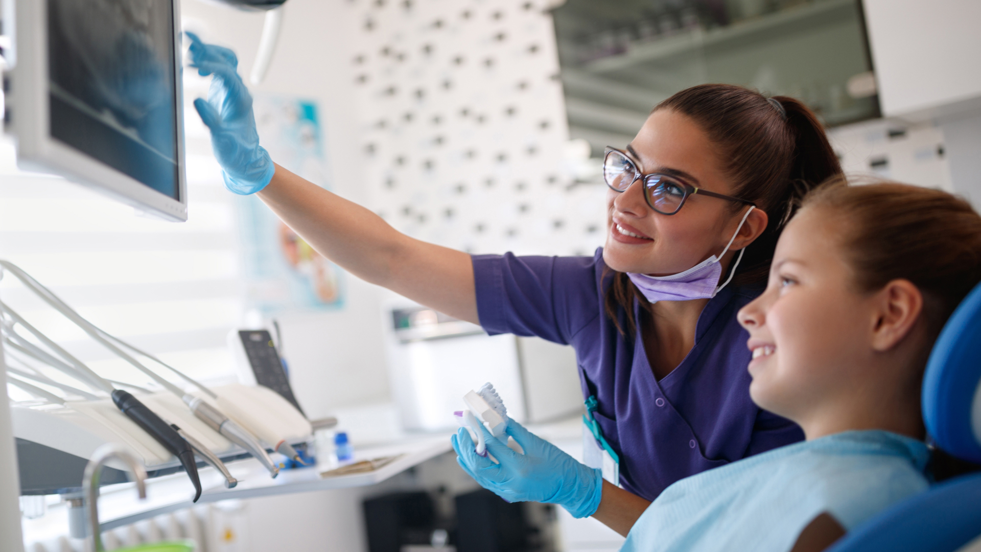 Dentist showing x-rays to a patient