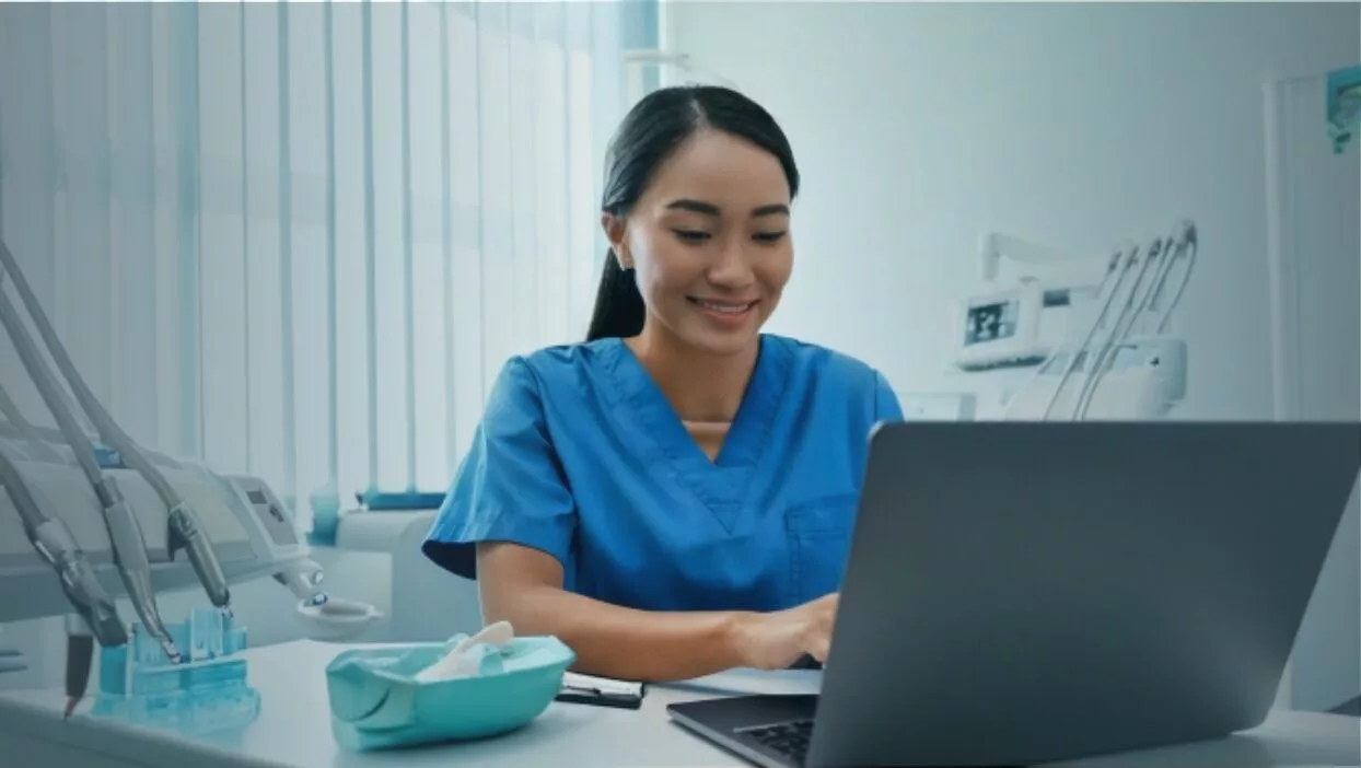 Dental Hygienist Looking at CE Courses